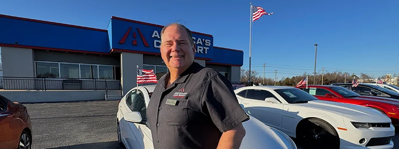 Ted Taylor Standing in Front of Americas Car-Mart