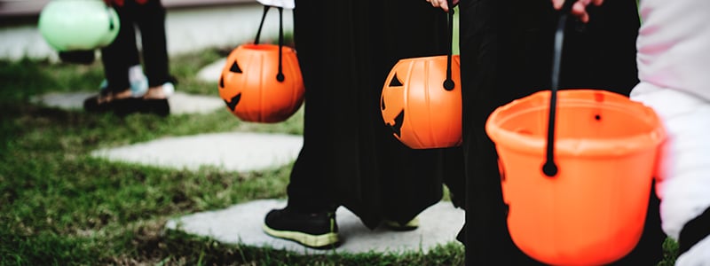 Little children in Halloween costumes