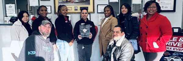 Car-Mart of Milledgeville team posing with Best of Business Rate 2024 Award