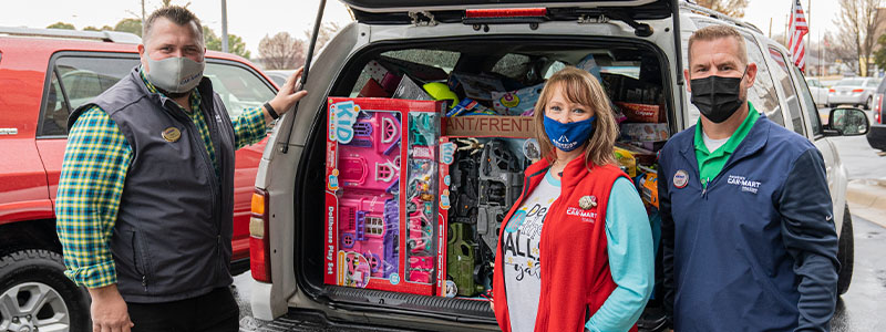 Car-Mart Toy Drive, delivering toys