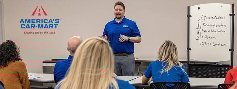 Ryan Human instructing a class of Future Managers