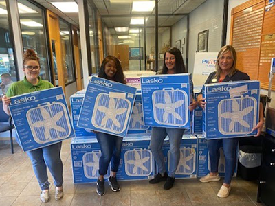 Car-Mart of Conway associates donating fans to the Bethlehem House
