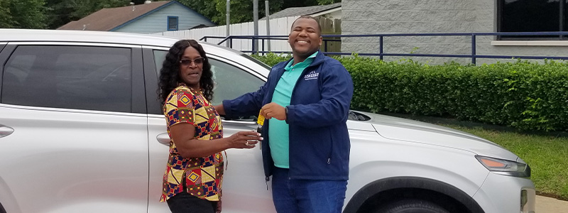 Car-Mart customer Brenda Patterson purchasing her latest vehicle from Car-Mart