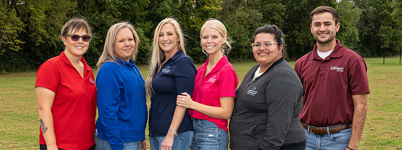 Car-Mart family, group photo of some of our associates who have family members also working for Car-Mart