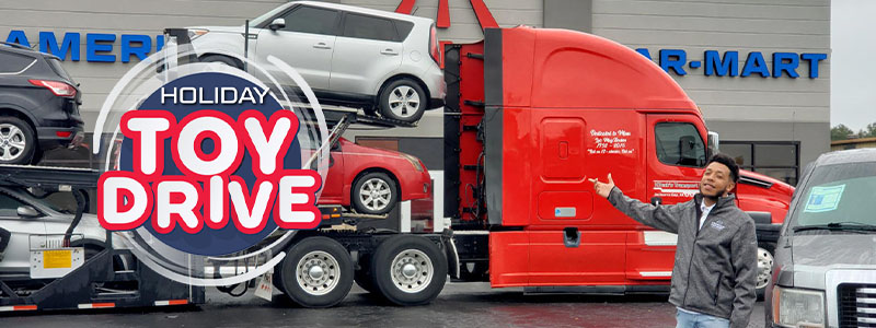 Car-Mart of Enterprise Associate pointing to the KBeck Truck