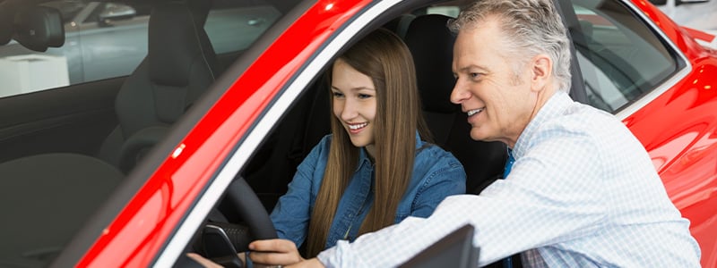 Father and daughter car shopping